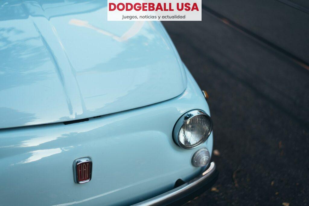 white FIAT car parked on asphalt road