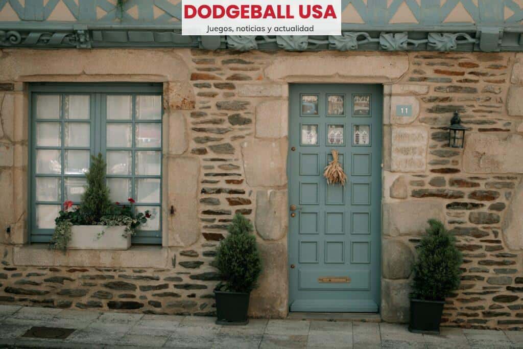 a close up of a stone building that has a green door