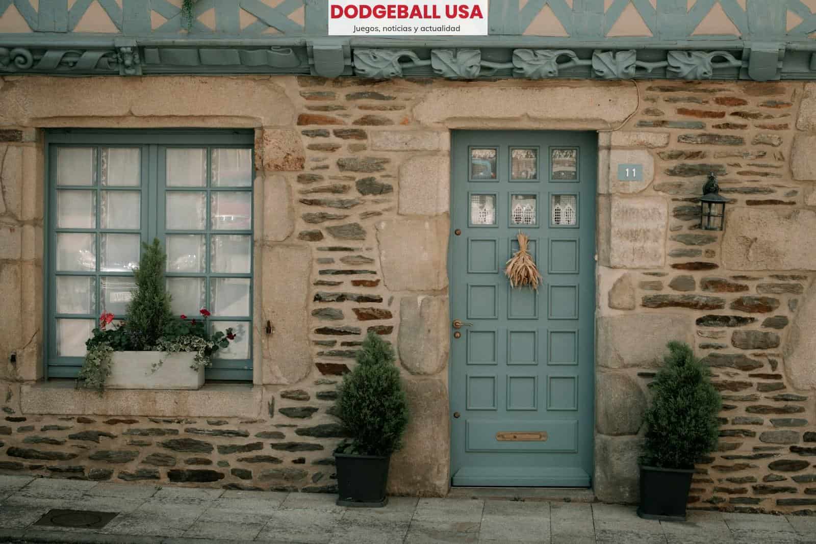 a close up of a stone building that has a green door